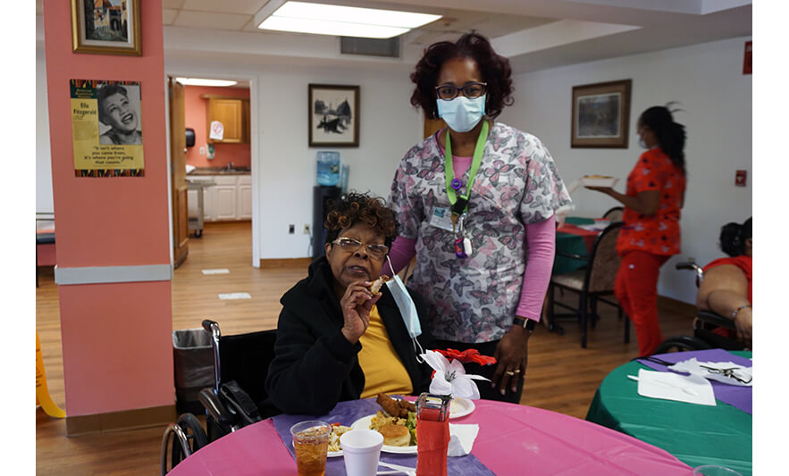 Extended Care Adopt-A-Resident Day 5-17-2023 Maria Cruz with woman in black and yellow for web