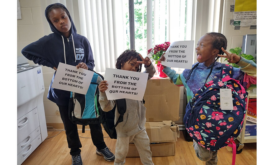 Harmony House kids with backpacks for web