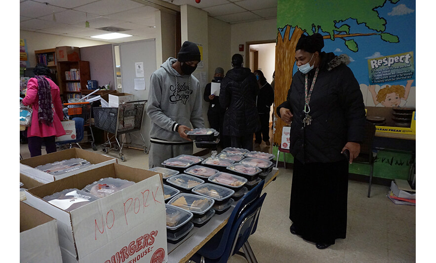 Withum Harmony House Thanksgiving 11-22-2021 Man getting meals for web
