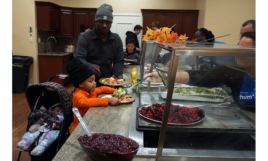 Withum Harmony House Thanksgiving Dinner 11-21-2022 Girl getting vegetables for web